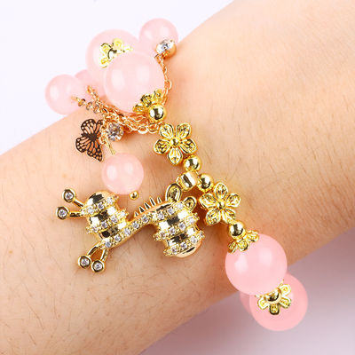Pulseira de 12 mm rosa de quartzo com feitiço de veado