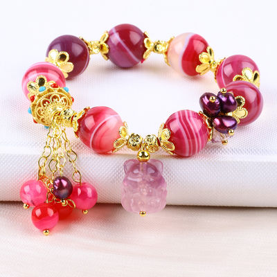 Pulseira de pedra de ágata rosa de 14 mm com escultura de raposa de nove caudas roxa