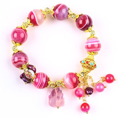 Pulseira de pedra de ágata rosa de 14 mm com escultura de raposa de nove caudas roxa